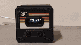Zone-hold gesture — near-zone hand hold, Spotify next track, OLED track line updates